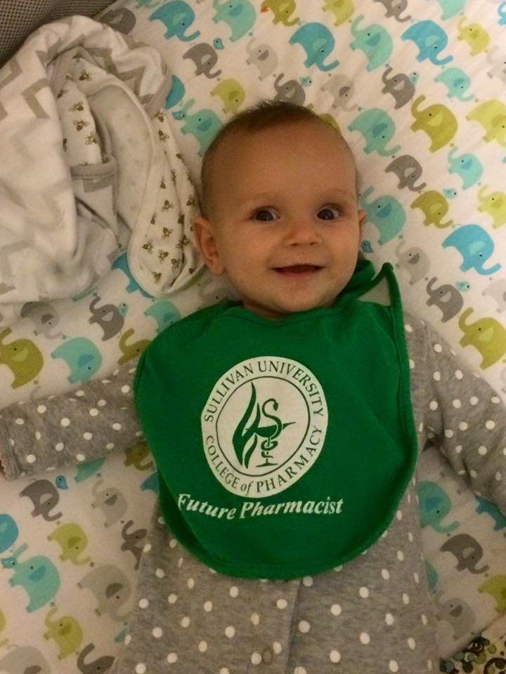 baby wearing a Sullivan University college of pharmacy future pharmacist bib
