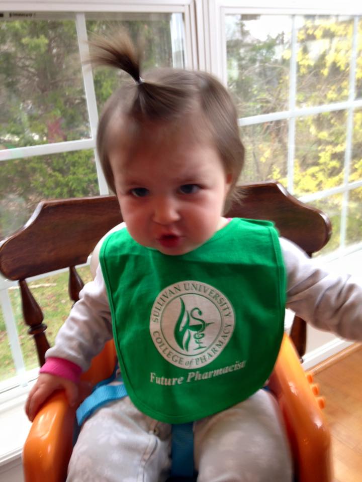 baby wearing a Sullivan University college of pharmacy future pharmacist bib