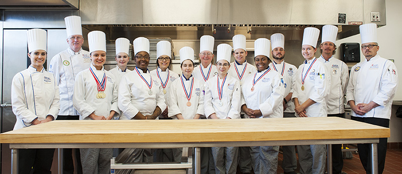 NCHS team posing and earing their medals